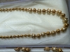 Picture of Gold Nakshi Balls and perl chain with earrings