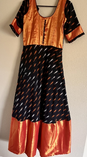 Picture of Orange and black beautiful Ikkat long frock with kanchi border