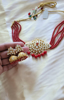 Picture of Red beads kundan choker with Jhumkis