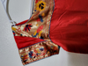 Picture of Bright red & gold color frock with pythani border