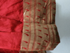 Picture of Bright red & gold color frock with pythani border