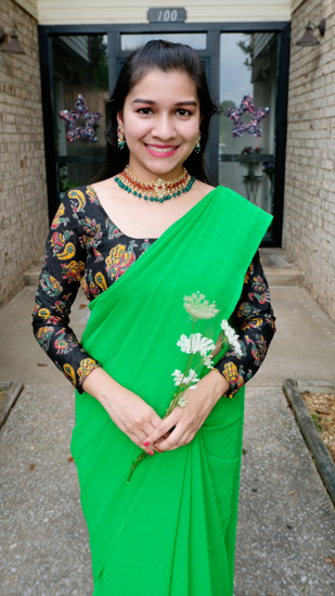Picture of Green georgette saree with necklace