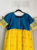 Picture of Green and yello long frock half sleeves and pattu border(XL)