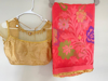 Picture of Pink  and gold color organza saree paired with gold color blouse