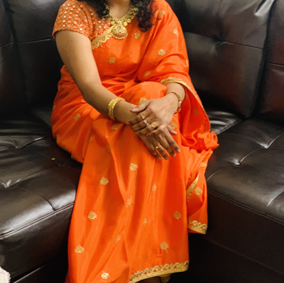 Picture of Bright Orange saree with matching mirror blouse