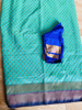 Picture of Mint green and blue fancy pattu saree
