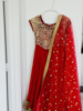 Picture of Red long frock with cutwork design