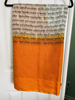 Picture of Beautiful script printed soft cotton saree in ivory and mango color paired with kalamkari blouse