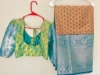 Picture of Light pista green Pattu saree and sea blue big border  saree paried with butta hands blouse