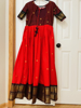 Picture of Tomato red and brown pattu  silk Long  dress with double  border and body yoke