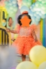 Picture of Orange pearl frock with feather detailing 1y