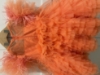 Picture of Orange pearl frock with feather detailing 1y