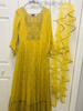 Picture of Mustard yellow long frock along with ruffle Duppatta