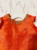 Picture of Orange and kalamkari thread work langa 2y