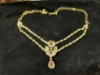 Picture of Diamond look alike stylish ruby neckset with earrings