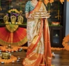 Picture of Exquisite Soft Gold & Champaine  Pink Brocade Pattu Silk Saree with Red border with Matching tissue Blouse