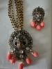 Picture of Coral Ganesha pendant with matching earrings with 4 lines black beads chain