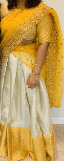 Picture of Cream and yellow color half saree